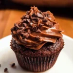 Delicious brownie cupcakes topped with chocolate frosting on a plate