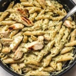 One Pot Creamy Pesto Chicken Pasta cooked in a skillet for an easy dinner