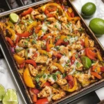 Colorful sheet pan chicken fajitas with peppers and onions roasted to perfection