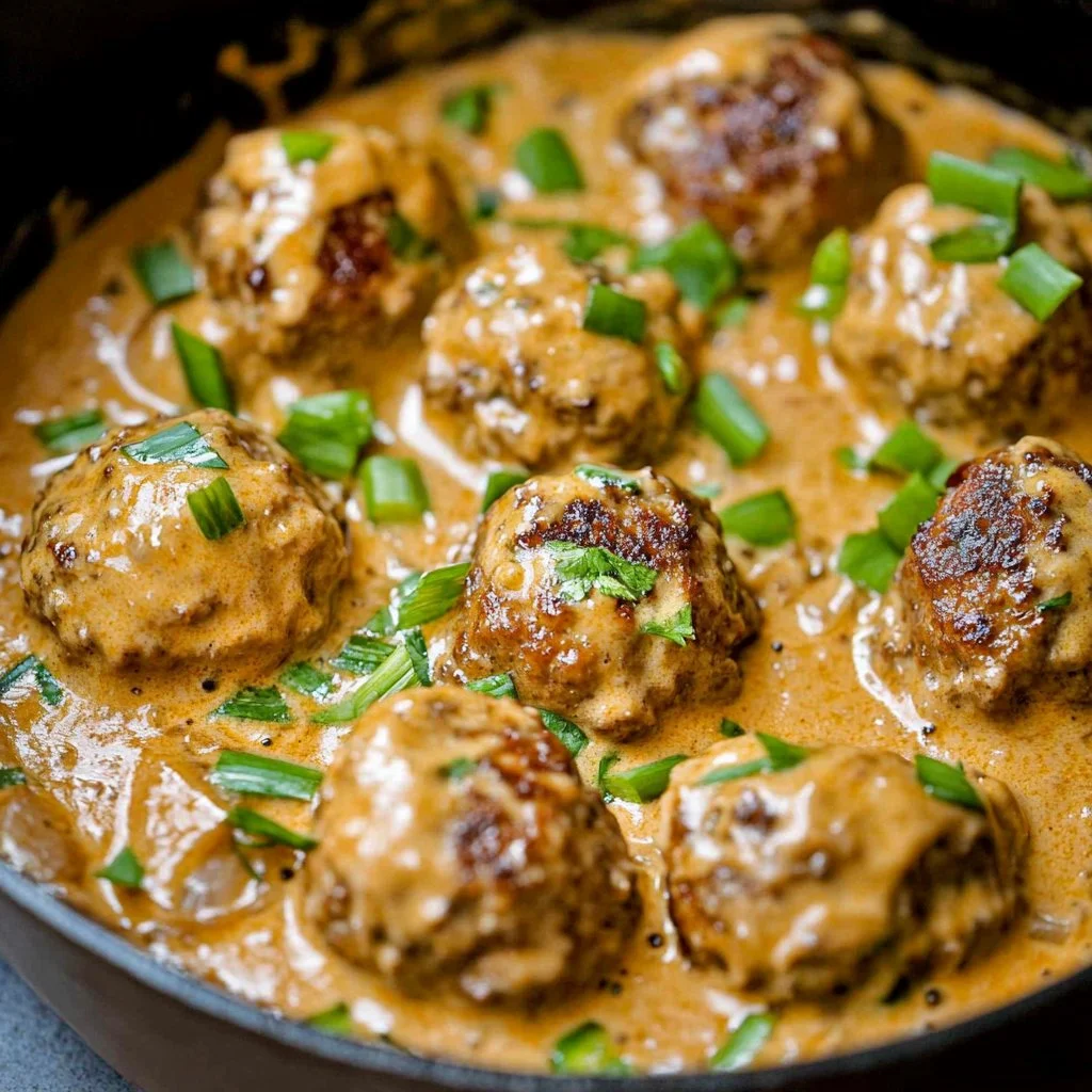 Delicious Keto Feta Burgers topped with rich Tomato Cream Sauce